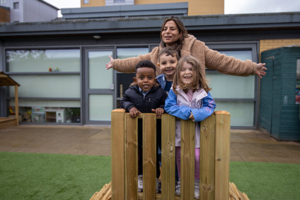 Children and nursery teachers having fun outside at LEYF Wandsworth Bridge Nursery